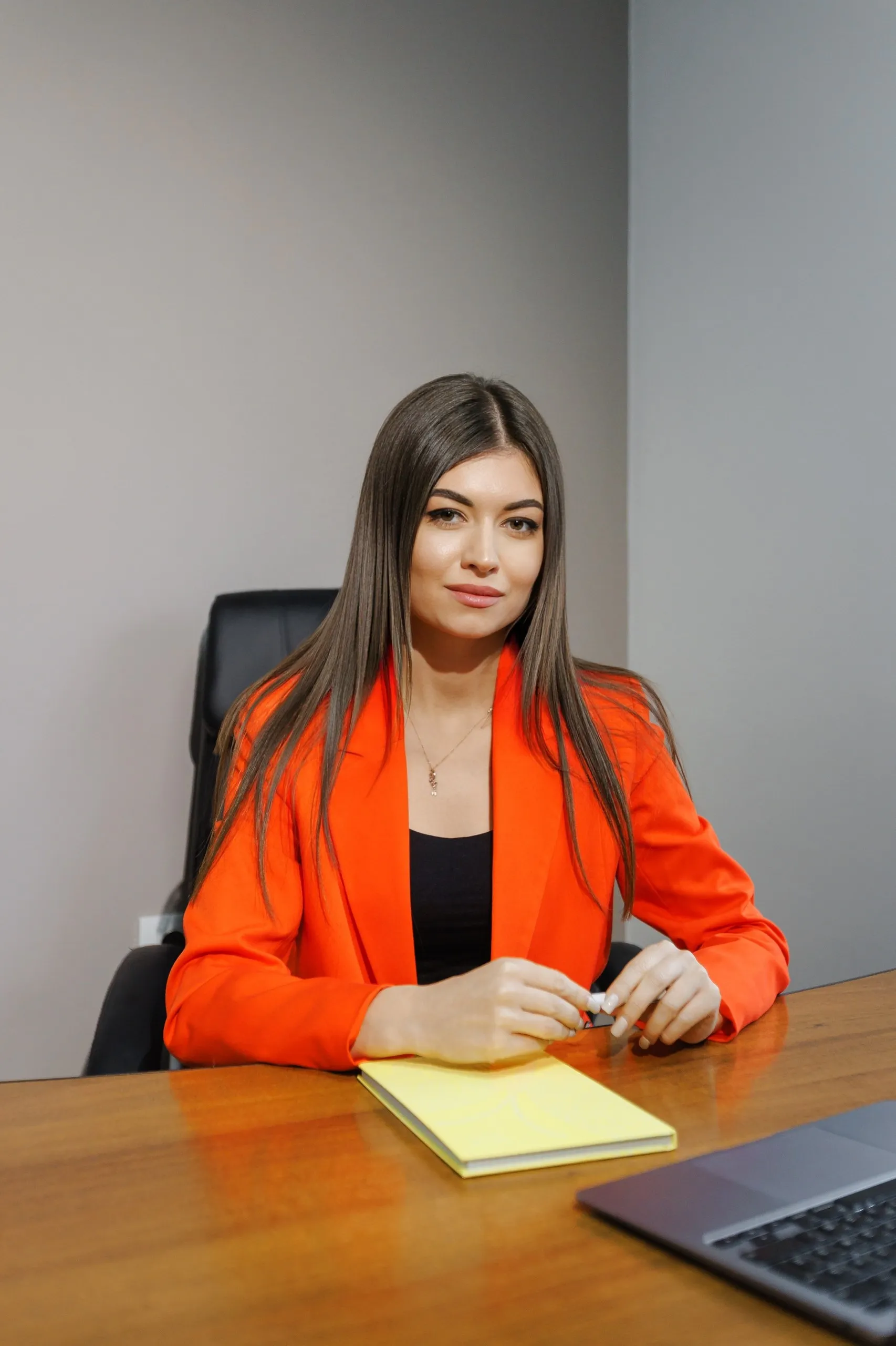 The founder and chief accountant of Fin Solutions, at the office desk